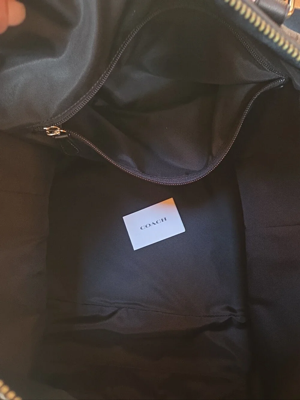 Coach Black Signature Leather Weekender tote bag dark gray and black.